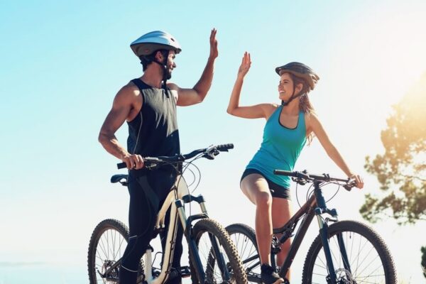 Best Mountain Biking Trails in Tucker County, WV: Two bike riders high-fiving